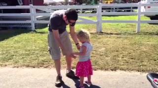 Charlotte and daddy dance at the fair