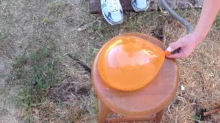 Poping a water balloon