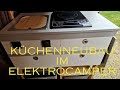 Elektrocamper Küche mit Induktionsplatte. Waschbecken und Kühlbox. #elektroauto #elektrocamper
