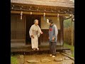 日比谷幸助（サラリーマン小説家）が雨宿りをするシーン（AI動画）