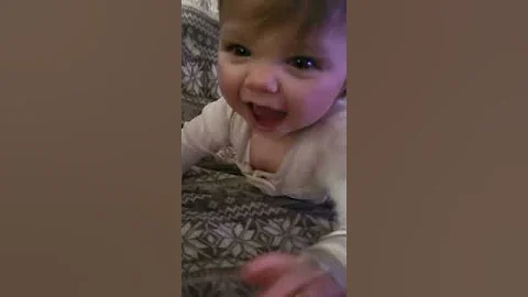 8 month old proud of herself for climbing onto cou...