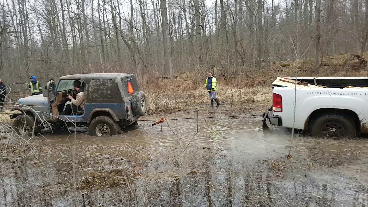 Cummins pulls out jeep and silverado at the same time - YouTube