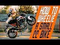 How to wheelie a small cc bike | RokON VLOG #25