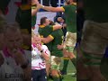 Siya Kolisi runs to comfort Cheslin Kolbe on the sideline after the game.