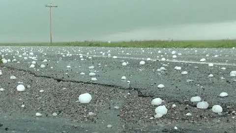 BREAKING: Windscreens Cracked As Hailstones Fall On Cars In Abuja