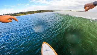 surfing awesome long waves at our secret spot