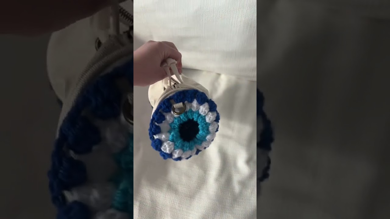 Watch me make an evil eye crochet purse!