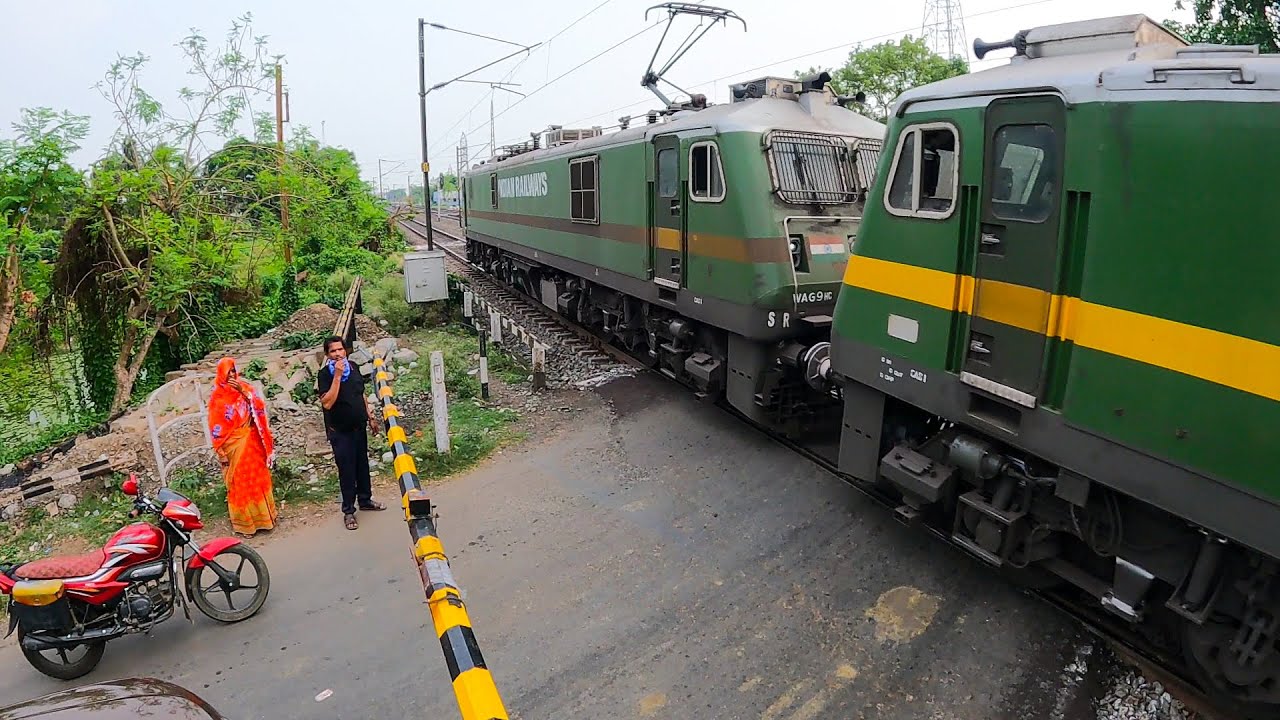 Twins Green Giant Wag9 Leads Loaded Boxn Wagons Freight Train crosses Furious Speed Between Railgate