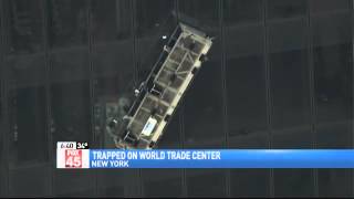Window Washers Rescued From Side of New World%