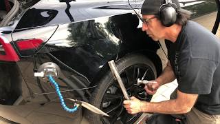 Tesla 3 dent repair on black quarter panel without repainting or refinishing. Paintless dent repair.