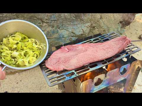 Grilled beef tongue with green onion and salt sauce over a bonfire on the beach!