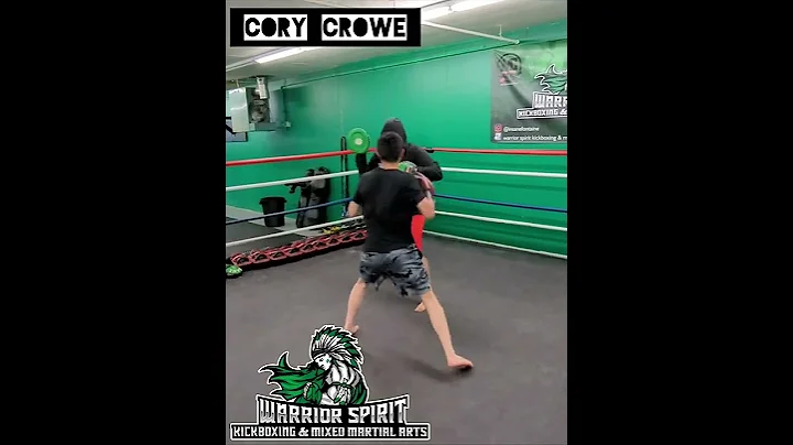 Cory Crowe hitting pads with Coach Insane Fontaine