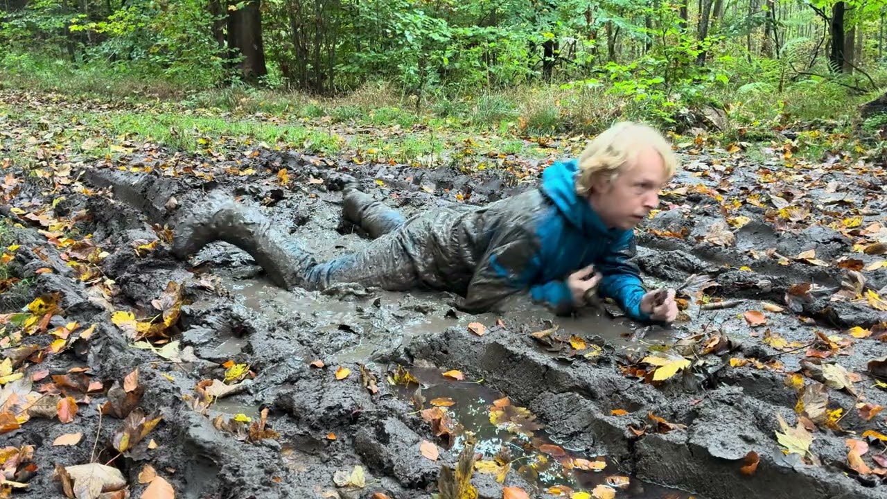 Teal dogcoach - snowsuit in the mud