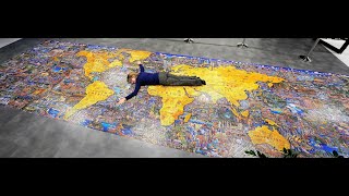 Dowdle 60000-piece What a Wonderful World, world's largest jigsaw puzzle (I 2023) hanged on the wall