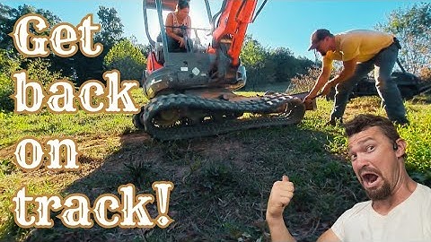 How to put a track back on a mini excavator.