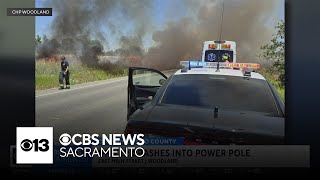 Driver crashes into Woodland power pole, causes small grass fires