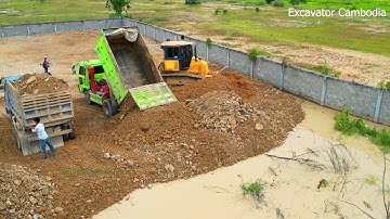 Part 8 Good Working Team Dump Truck Unloading Stone Soil And Bulldozer Pushing Back Fill In Fence