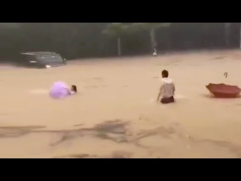 Strangers rescue woman and child from flood