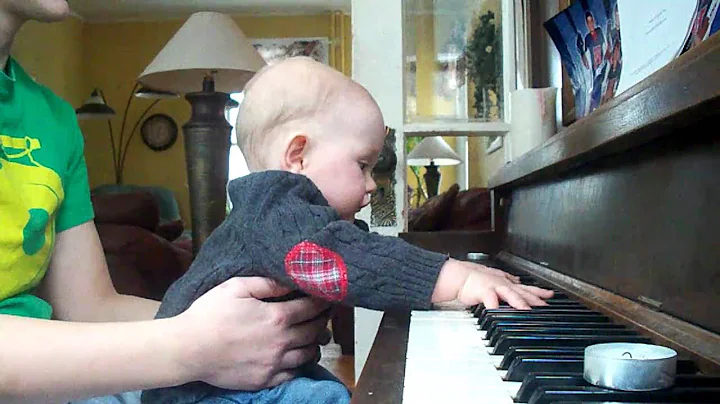 Funny baby playing piano