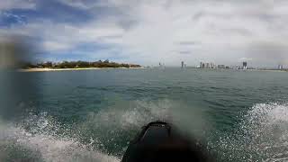 Jumping boat wakes on stand up jet ski