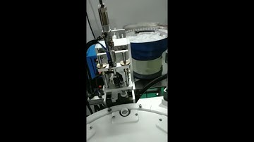 Automatic inner outer cap assembly machine with glue applicator