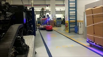 Robos Tugger AGV with e-frame trailers.