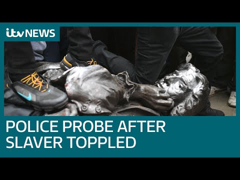 Police launch investigation after anti-racism protesters topple statue of slave trader 