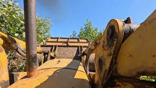 John Deere 450 Loader/Crawler Clearing Field