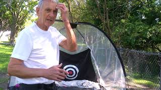 NORMAL00002  76 yr old man hitting 100 shots with brand new 7 wood into net using launch monitor
