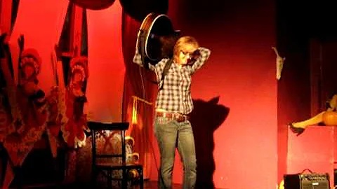Acoustic Guitarist Renee Guthrie plays guitar behi...