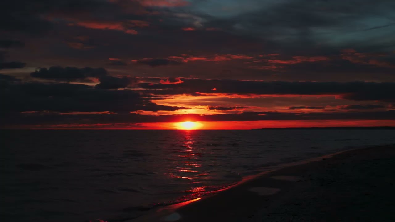 Deep Red Canadian Sunset over Lake Erie from the beach at Port Stanley in 4K 60FPS