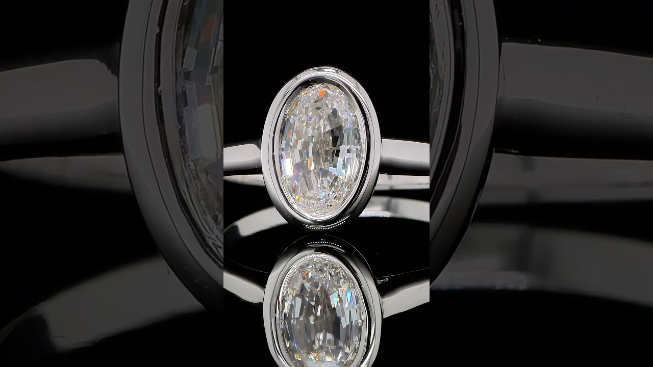 Oval Step Cut Bezel Diamond Ring In 18K White Gold Gia Certified - Orogem Jewelers