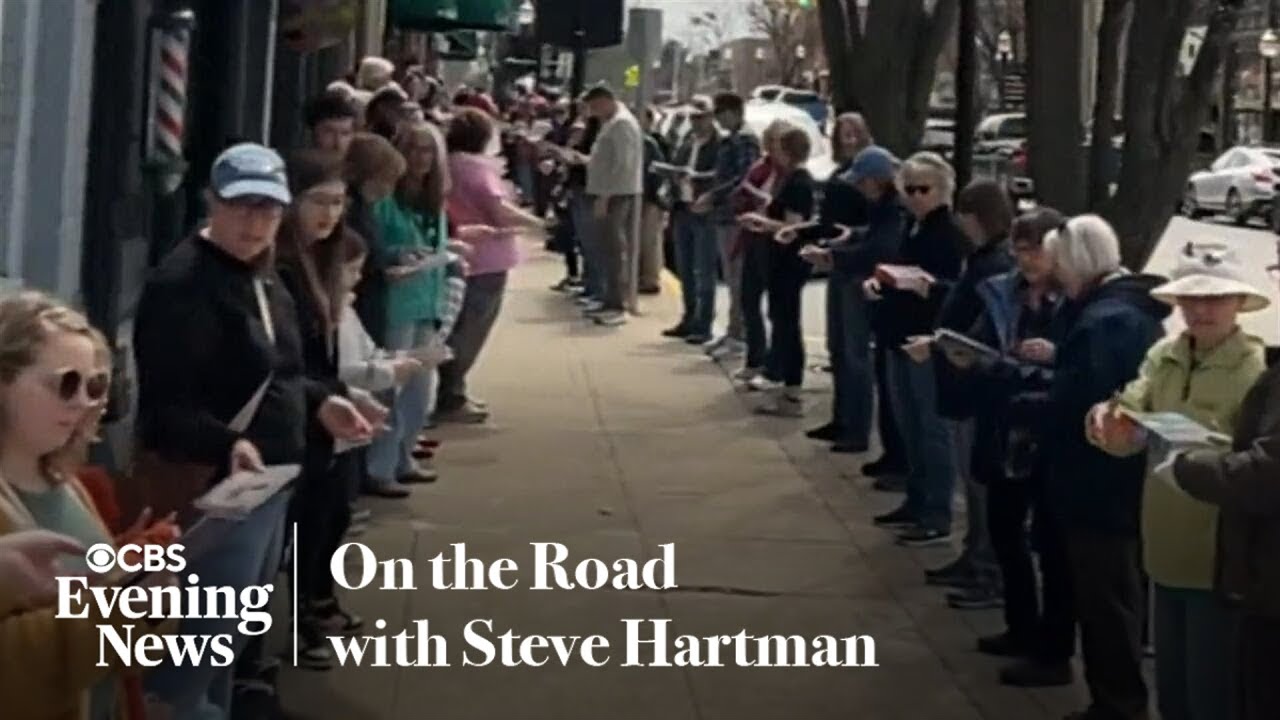 Hundreds form a human chain to move a Michigan bookstore by hand