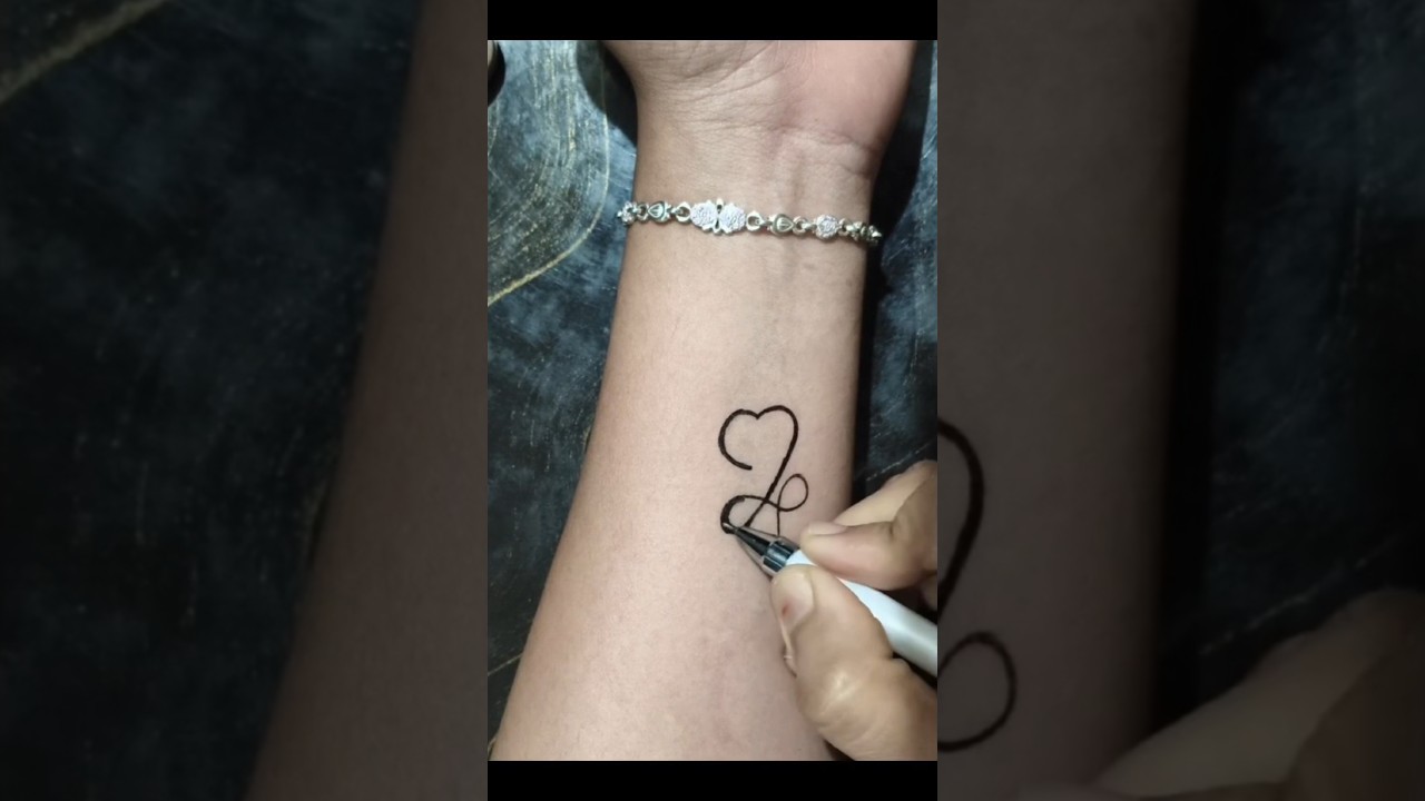 DIY design heart temporary tattoo on hand... 