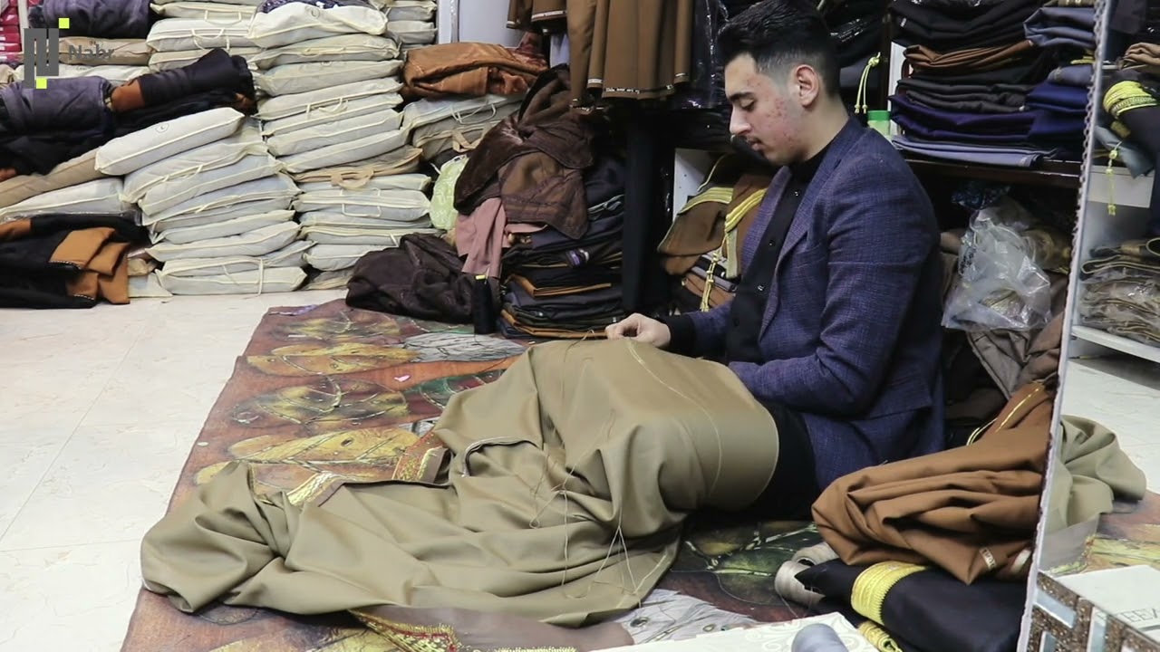 نَبر توثق سوق الحميدية في مدينة الفلوجة لصناعة الزي العربي