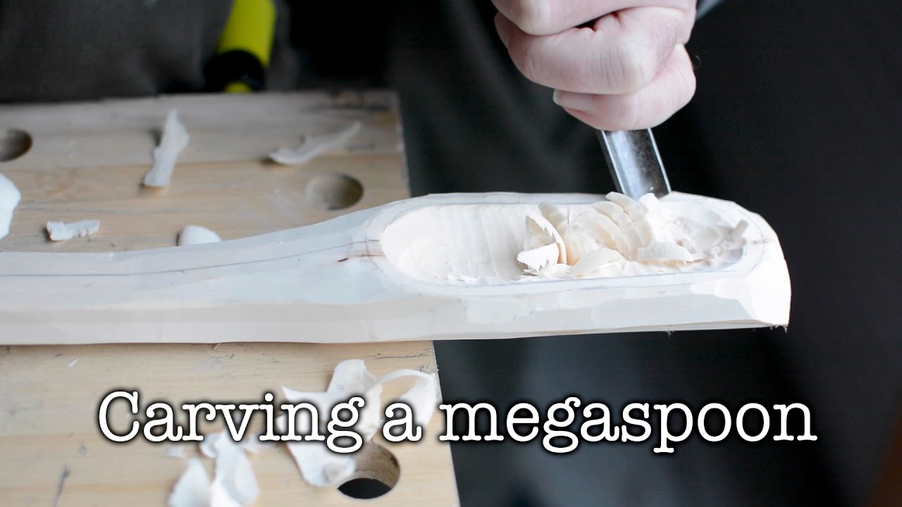 Carving a big spoon.