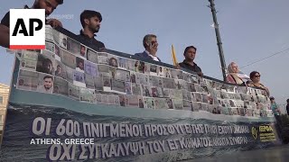 Protest in Athens as trial begins on last year