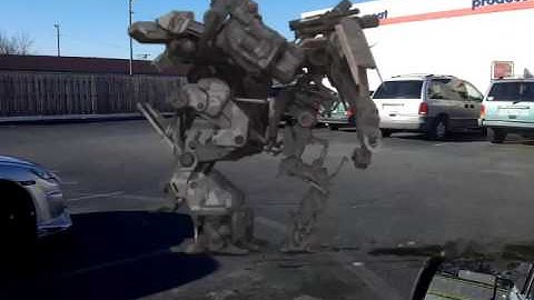 Robots fighting in store parking lot /  FxGuru Video