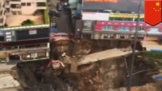 Caught on Camera: Watch as sinkhole swallows entire city street in China - TomoNews