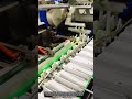 Robotic claw mechanism optimizing product spacing across multi-lane conveyors