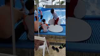 Guy Learning Surfing on Simulator Faceplants into Water - 1040602