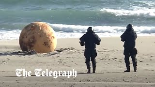 Spy balloon? Japan baffled by mysterious metal ball washed up on beach