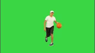 Young Basketball Player Training Before Game Throwing Ball in Basket on a Green Screen Chroma Key