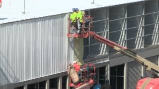 Watch Rose Employees Install Metal Walls