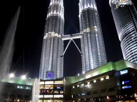 Im in Kuala Lumpur for three days on business and so time to squeeze in the local landmarks. The first stop on any sightseeing expedition here has to be the dramatic Petronas Twin Towers, one of the most famous skyscrapers in the world and very handily less than a ten minute walk from the guest house where I am staying for a couple of nights. Its acres of steel shine in the daytime sunlight and are floodlit spectacularly at night meaning that you can see the towers from almost anywhere in the city; they are the focal point that the city's hub revolves around. To get to them a map is barely necessary, you just point in their direction and they guide you. When it opened in 1998 the Petronas Twin Towers, with 88 floors, was the tallest building in the world, a few metres higher than the famous Empire State Building. The skyscraper certainly did its job: it put the city on the global map and turned state petroleum company, Petronas, into a household name. Six years later Tapei 101 took over its mantle as it was just over 50 metres higher, and since then the Sears/Willis Tower in Chicago arrived on the skyscraper scene it is almost equally as tall before the 160 floor Burj Khalifa in Dubai, which has just officially opened, shattered the established order with an unmatchable height of 828 metres. However for sheer visual appeal and global recognition, the Petronas Twin Towers, already immortalized in a Hollywood movie, is arguably still the most famous skyscraper in the world <b>...</b>