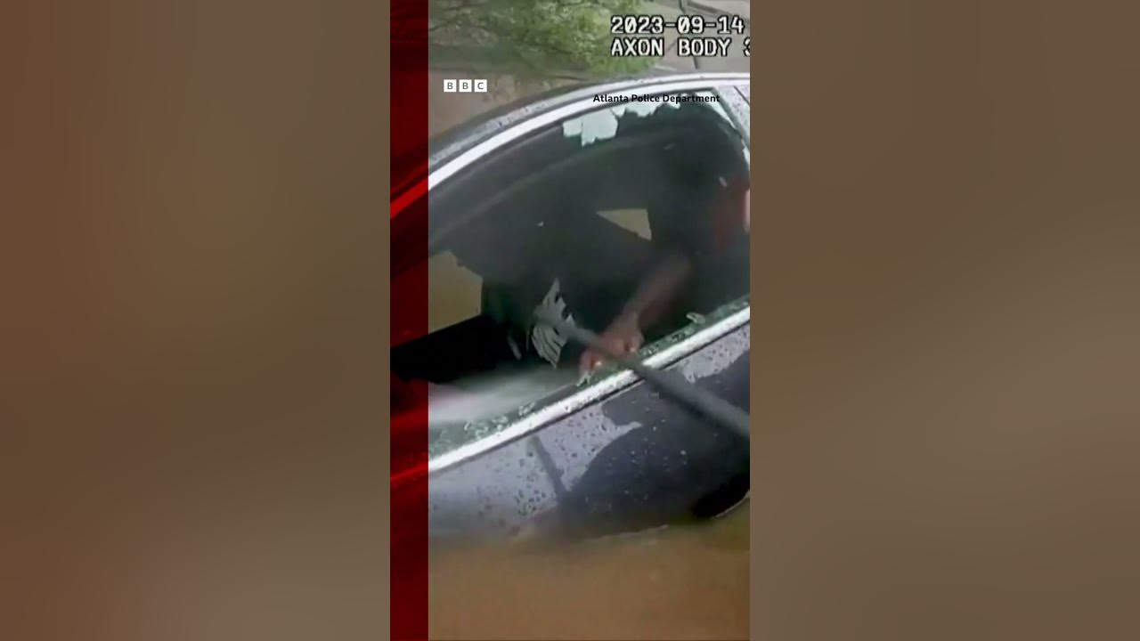 The moment a US police officer smashed a car to rescue a man from drowning #Shorts #BBCNews