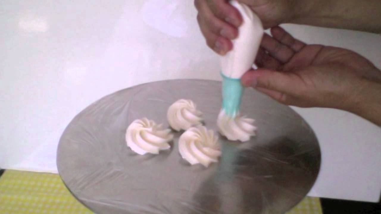 Piping A Cake With Whipped Cream Piping A Cake With Whipped Cream
