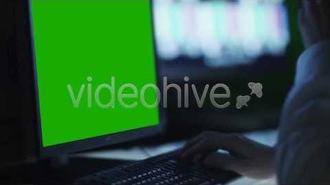Officer is Monitoring Displays with Green Screen | Stock Footage - Videohive
