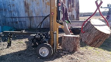 Moving and Splitting those extra large wood rounds.  Assist from the Kioti CK3510.
