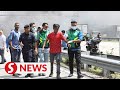 Nine foreign workers rescued from burning billboard along Federal Highway